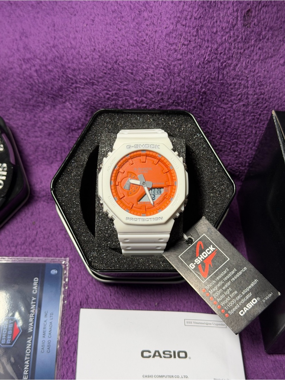 Casio G-Shock White Watch with Orange Dial Accent